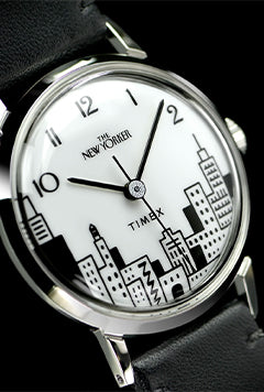 A stylish and sophisticated shot showcasing the Timex x The New Yorker collaboration watch. The image highlights the watch’s elegant design, featuring classic details, refined craftsmanship, and branding inspired by The New Yorker.